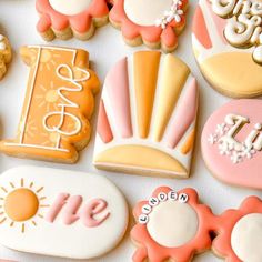 many decorated cookies are arranged on a table