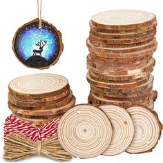 a stack of wood slices with a christmas ornament hanging from it's side