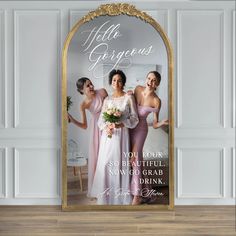 a photo frame with the words hello gorgeous and three women in pink dresses standing next to each other