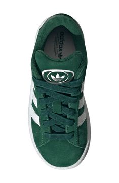 Serrated 3-Stripes and a heritage Trefoil stand out on this kid-size sneaker featuring plush cushioning on the tongue and cuff for a skate-inspired twist. Pull-on style with elastic laces Leather, textile and synthetic upper/textile lining/rubber sole Imported Green Adidas Synthetic Skate Shoes, Adidas Green Synthetic Skate Shoes, Adidas Green Skate Shoes With Three Stripes, Adidas Low-top Sneakers For School, Green Three Stripes Sports Sneakers, Green Three Stripes Sneakers For Sports, Adidas Sporty Sneakers For School, Green Sneakers With Three Stripes For Sports, Green Skate Shoes With Three Stripes And Round Toe