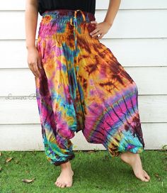 "💥One Size Fits Most Comfortable Low Cut Drop Crotch Tie Dye Harem Pants, Hippie Pants, Tie Dye Baggy Pants, Festival Harem Pants, Festival Clothing, Tye Dye Genie Pants, Tie Dye Comfy Pants 👉Fabric: Soft and Breathable Rayon 👉Smocked Elasticated Waist: 26\" up to 54\" 👉Hips up to: 60\" 👉Total Length: 39\" (Top to Bottom) 👉 Around elastic ankle 10\" 👉 Tie Dye Method 👉 One Size Fits M-XL or US 2-20 👉Extremely Comfortable 👉Boho/Hippie Theme, Beach Wear/Festival Going Pants Note: Due to t Baggy Parachute Pants For Summer Festivals, Bohemian Baggy Parachute Pants For Summer, Summer Bohemian Baggy Parachute Pants, Summer Hippie Harem Pants With Loose Fit, Summer Hippie Harem Pants With Loosely Fitted Hips, Summer Multicolor Baggy Harem Pants, Baggy Multicolor Harem Pants For Summer, Hand Dyed Tie Dye Pants For Summer, Summer Hippie Baggy Pants