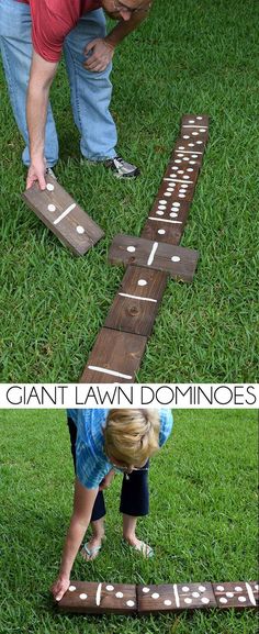 two people playing with wooden blocks in the grass