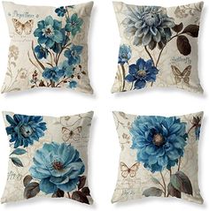 four pillows with blue flowers on them