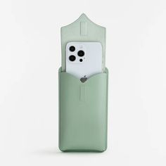 an iphone in a green leather case