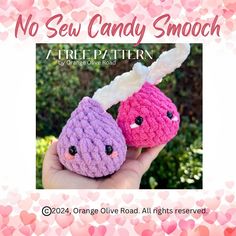 two small crocheted candy candies in pink and purple