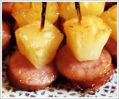 pineapple and sausage skewers on a plate