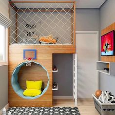 a kid's bedroom with a basketball themed bed and play area in the corner