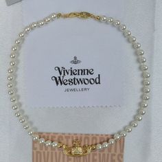 Vivienne Westwood Pearl Necklace Mini Bas Relief Choker In Gold The Silver-Tone Mini Bas Relief Pearl Choker Is Strung With A Row Of Glass-Based Swarovski Pearls And Finished With A Crystal-Studded Orb Pendant In The Centre. Brand New With Gift Box, Gift Bag, And Dust Bag,Brand Cards,Instruction 1 Row Faux Pearl Bas Relief Necklace Total Chain Length:15.75'' Orb Dimensions: H 0.67'' * W1.06'' Pearl Dimensions: 0.24'' Beautiful Heavy Piece Metal Brass Alloy Welcome To Reasonable Offer Vivienne Westwood Mini Bas Relief Choker, Vivienne Westwood Pearl Necklace, Vivienne Westwood Jewellery, Pearl Choker, Swarovski Pearls, Vivienne Westwood, Faux Pearl, Womens Jewelry Necklace, Gold Color