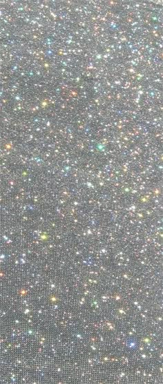 the back side of a computer screen with lots of glitter on it's surface