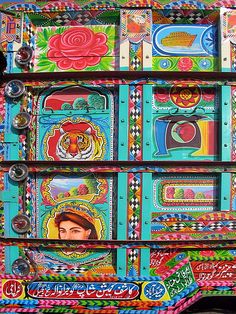 an elaborately decorated truck is parked on the street