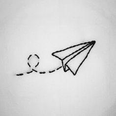 a drawing of a paper airplane flying in the sky with a string attached to it