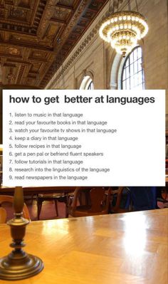 a table with a sign that says how to get better at languages in front of it