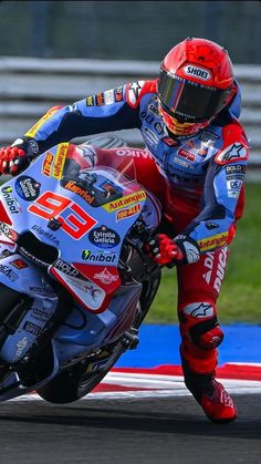 a person riding a motorcycle on a race track