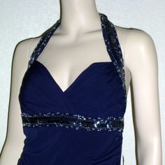 #2042 Color On Tag: Navy Beaded Halter Neckline Pleated Bodice Built-In Bra Beaded Embellishment Beneath Bodice Hidden Back Zipper Closure Split Skirt At Side Seam Low Back 92% Polyester 8% Spandex Lining: 100% Polyester Doll Brooch, Split Skirt, Prom Colors, Pleated Bodice, Formal Gown, Halter Neckline, Formal Gowns, Boutique Dresses, Low Back