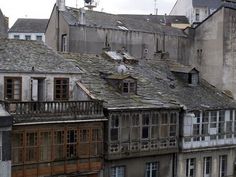 an old building with lots of windows and balconies