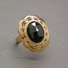 An elegant antique / vintage golden ring, handcrafted of 14 carat yellow gold, with filigree detailing. The central piece of this Victorian style ring is an oval faceted genuine red garnet of very dark red color. This ring is a high quality authentic Dutch heritage jewelry item, handcrafted in Holland circa 1950's, may be earlier. The ring will be shipped in a gift box. Garnet is the birthstone of January. It is also traditionally known as the gemstone of commitment and love.  Ring size: 17.1 mm Garnet Jewelry Set, Victorian Style Rings, Pyrope Garnet, Dutch Heritage, Dark Red Color, Heritage Jewellery, Golden Ring, Garnet Jewelry, Red Gemstones