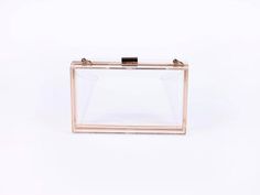 Clear acrylic rectangular clutch handbag perfect for any stadium or game day / football / college event where see-through bags are required. Size is large enough to fit the iPhone15Pro Max as well as small lipstick, keys, etc. - Can also be worn out as the perfect addition to your outfit for brunch, dinner, weddings and more! Gold strap can be used as shoulder or crossbody strap. - Material: Acrylic with Gold Finish / Hardware - Product size: 7.1 in x 4.1 in x 2.2 in - Gold Shoulder Strap Includ Clear Rectangular Bag, Stadium Outfit, Outfit For Brunch, Acrylic Purse, College Event, Mens Outerwear Fashion, Football College, Game Day Football, Acrylic Clutch