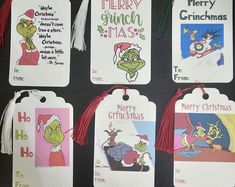 the grinnies christmas gift tags are hanging on a wall