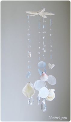 a mobile with seashells and shells hanging from it