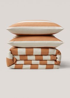 three pillows stacked on top of each other