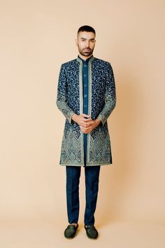 "Make an edgy statement with our WINE EMBROIDERED INDO WESTERN designed thoughtfully for the modern Indian man. A fusion staple fit for every occasion, adds the right amount of cultural twist to the western silhouette. Color: Purple Neck: Mandarin Collar Fabric: Micro Velvet Embroidery: Thread Work With Sequin Embroidery Garment Type: Indo Western The Product Price is inclusive of: 1 Indo Western and 1 Trouser Style bottom Model is 6'2\" wearing Size 38 Product color may slightly vary due to photographic lighting sources or your screen settings." Green Bandhgala With Zari Work For Eid, Bollywood Style Green Nehru Jacket With Zari Work, Green Bollywood Nehru Jacket With Zari Work, Bollywood Style Green Sherwani With Resham Embroidery, Green Formal Traditional Wear For Transitional Season, Bollywood Style Green Nehru Jacket With Cutdana, Green Bollywood Nehru Jacket For Wedding, Bollywood Style Green Sherwani With Cutdana, Green Bollywood Sherwani With Cutdana