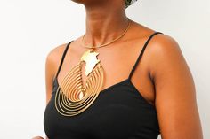 AISHA African brass necklace has a hammered texture hence making it appealing.

Material: Upcycled brass

Processing Time: Ready to ship within 1-3 days

Shipping fee is calculated during checkout

Shipping: DHL Express shipping with 3-5 days delivery

Care instructions:

Brass tarnishes with exposure to moisture and oxidation.

To clean it, kindly use a lemon wedge. Squeeze the juice and polish along the surface with a clean cloth. Hammered Gold Copper Necklace, Gold Hammered Copper Necklace, Dashiki Shirt, Dashiki Dress, Wooden Bracelet, Lemon Wedge, Beaded Belt, Brass Necklace, Scarf Jewelry