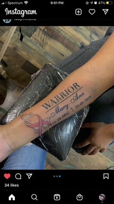 a person with a tattoo on their arm that says warrior and merry christmas written in red