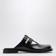 Black calfskin leather Loewe sabot featuring a round toe, a double buckle fastening and a leather sole. Calf Leather Slip-on Loafers With Buckle Closure, Spring Leather Monk Strap Shoes With Rubber Sole, Classic Slip-on Mules With Buckle Closure, Business Calf Leather Mules With Leather Footbed, Business Sandals With Leather Sole And Closed Toe, Spring Leather Monk Strap Shoes With Leather Sole, Leather Slip-on Mules With Tang Buckle, Business Clogs With Leather Footbed And Round Toe, Modern Slip-on Mules With Buckle Closure