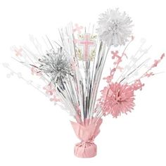 a vase filled with pink and silver flowers