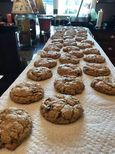 chocolate chip cookies are lined up on a table