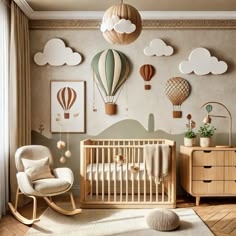 a baby's room with hot air balloons on the wall