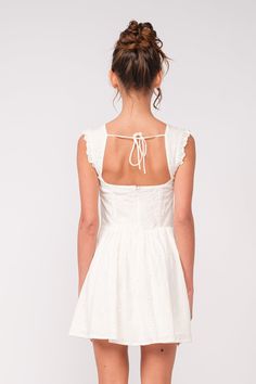 Always be charming in the Blakely White Eyelet Bustier Mini Dress! White pierced floral embroidered fabric shapes this darling dress that has ruffle trim shoulder straps and a bustier bodice with a front tie. The fitted waist sits on top of a fit-and-flare skirt that falls to a mini hem. Self-tie and hidden zipper/clasp at back. DETAILS & CARE Cotton. Machine wash cold. Imported. Bustier Mini Dress, Lover Girl, Fashion Merchandising, White Eyelet Dress, Fit And Flare Skirt, Darling Dress, Bustier Dress, Pink Boho, Eyelet Dress