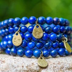 💙 Let your style blossom with our stunning Lapis Lazuli elastic bracelet. Wear it solo or team it with our Blue Spotted Jasper and Amethyst bracelets for a fresh take. You can find them all together in our Blue's Stack. STONE INFO ... Lapis lazuli is a source of wisdom and authenticity. Its velvety blue metamorphic rock has long been admired for its intense hue. During the Renaissance, this gem was ground down to make the rich shade of ultramarine for artworks. Spiritual Blue Gemstone Beads Wrap Bracelet, Blue Spiritual Wrap Bracelet With Gemstone Beads, Spiritual Blue Wrap Bracelet With Gemstone Beads, Blue Spiritual Stackable Jewelry, Blue Stackable Stretch Bracelet, Stackable Blue Stretch Bracelet, Blue Natural Stone Bracelets For Friendship, Blue Natural Stones Bracelets For Friendship, Blue Natural Stones Friendship Bracelets