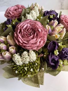 a bouquet of flowers sitting on top of a table