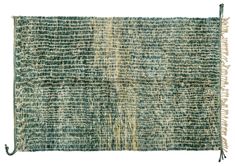 an old green rug with fringes on the bottom and sides, in different colors