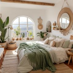 a bedroom with an arched window and lots of plants