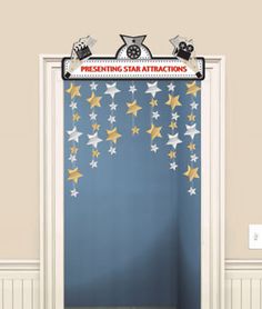 an open door to a room with stars hanging from the ceiling and a sign that says presenting star attractions