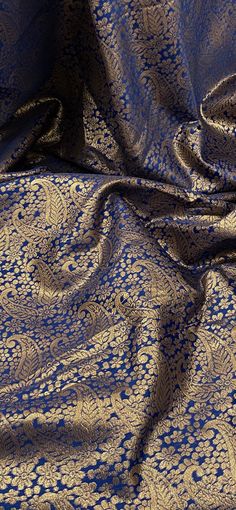 Our Banarasi Brocade is as divine as it looks. This fabric is richly designed with raised patterns to give it a gorgeous and appealing look. Perfect for all types of dressmaking, crafting, decorating and various other projects. *Colours may vary due to different screens. *Width 50 inches *Synthetic *Machine Washable *If you order more than 1 meter, fabric will come as one continuous length. *Fast Delivery Before you go please check out our other items. We offer combined postage and special deliv Banarsi Fabric, Dance Costumes Dresses, Orange Curtains, Gold Paisley, Pink Wedding Theme, Beaded Tulle, Royal Blue And Gold, Bridal Fabric, Blossom Design