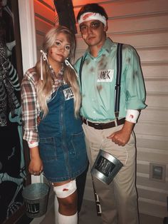 a man and woman dressed up as zombies