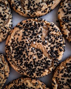 an assortment of cookies with black seeds on them