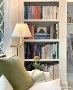 a living room filled with lots of books