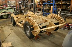 a large wooden boat being built in a shop