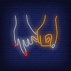 two hands holding each other neon sign on brick wall background with red and yellow lights