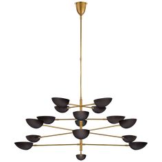 a large chandelier with black and gold shades on the bottom, hanging from a golden metal rod