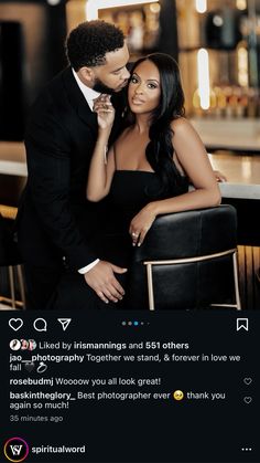 a man and woman sitting next to each other in front of a bar with lights