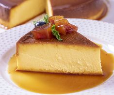 a piece of cheesecake on a plate with caramel sauce and garnishes