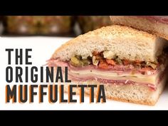 a close up of a sandwich on a white plate with the words, the original muffletta