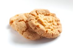 two peanut butter cookies stacked on top of each other with one cookie in the middle