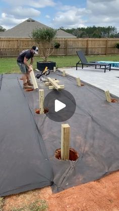 a man is working on an outdoor pool