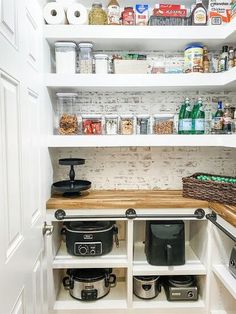 an organized pantry with pots, pans and other kitchen items on the counter top